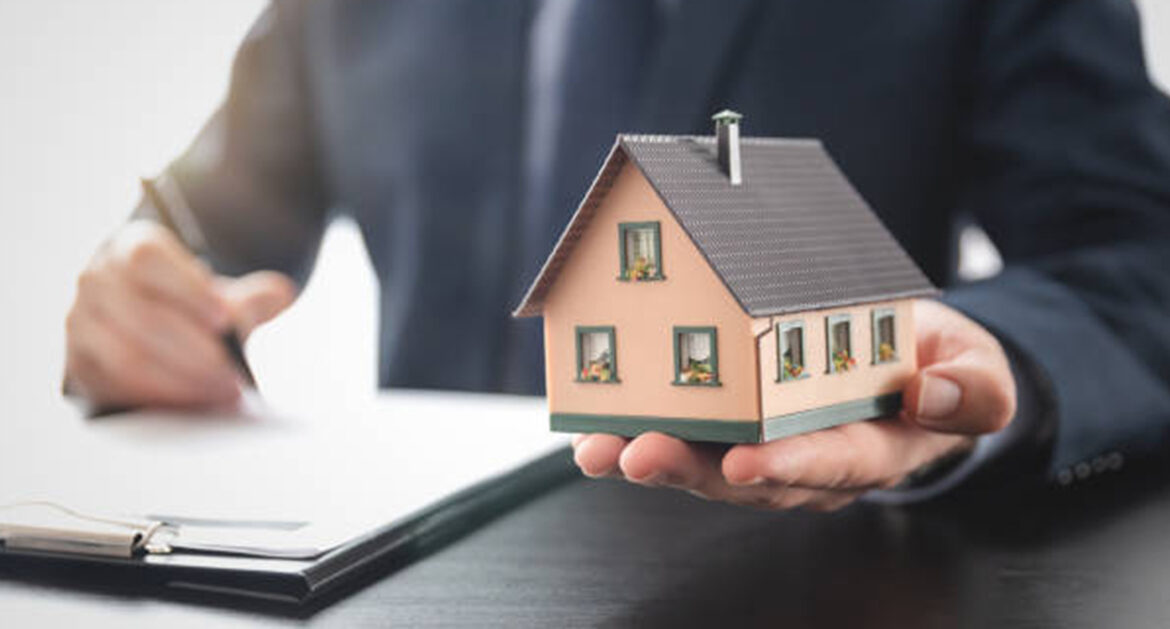 graphic of person holding small house