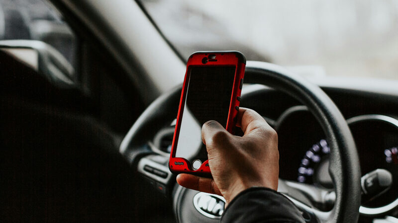 driver distracted by phone in car